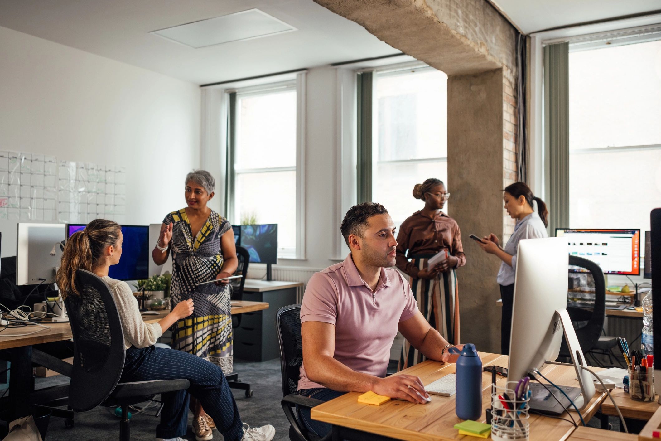 Cybersecurity professionals collaborating in an office